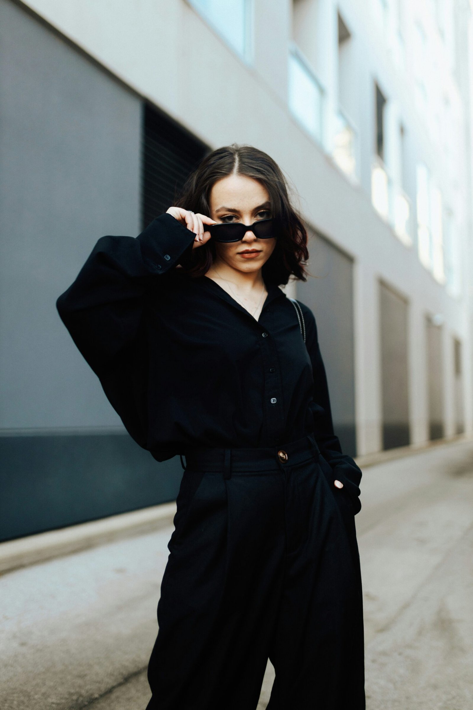 a woman in a black shirt and black pants